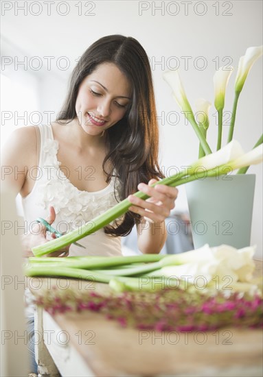 Brazilian woman arranging flowers