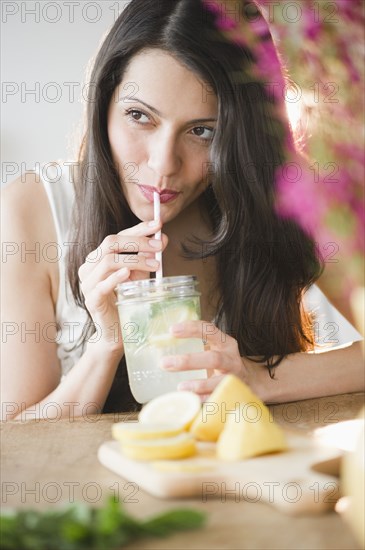 Brazilian woman drinking lemonade