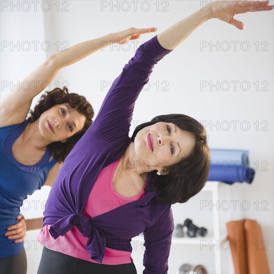 Women exercising in health club