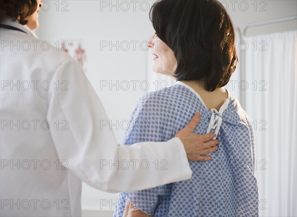 Doctor with patient in examination room