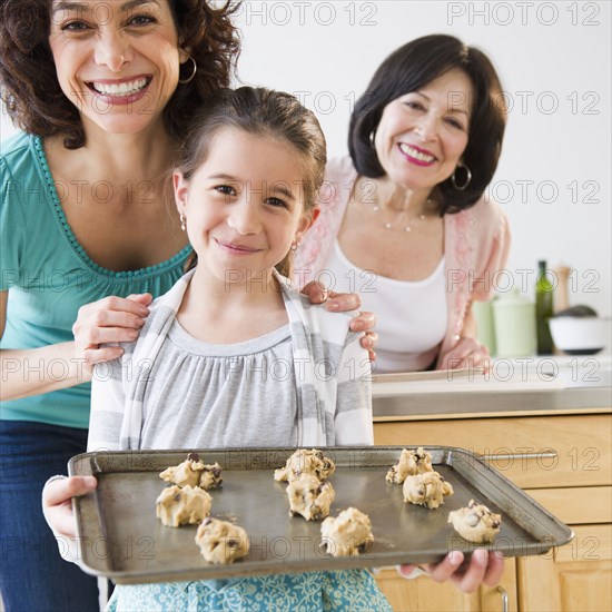 Family baking cookies together