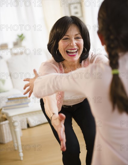 Grandmother hugging granddaughter