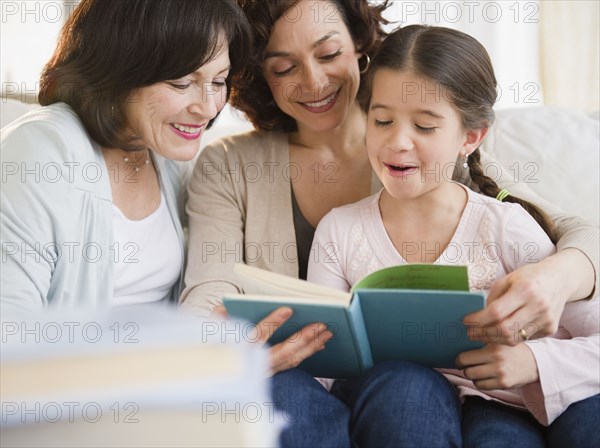 Family reading book together