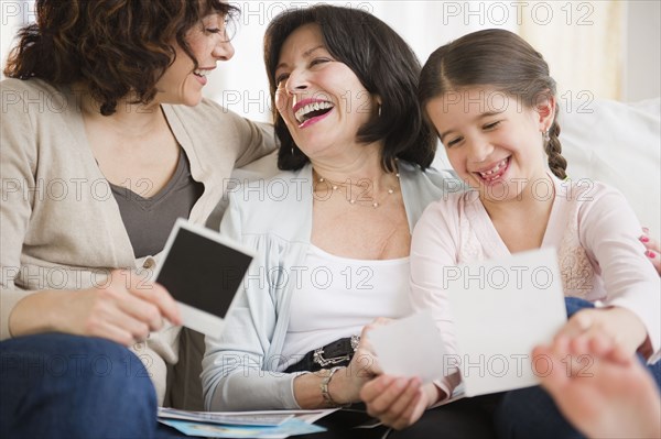 Family looking at photographs together