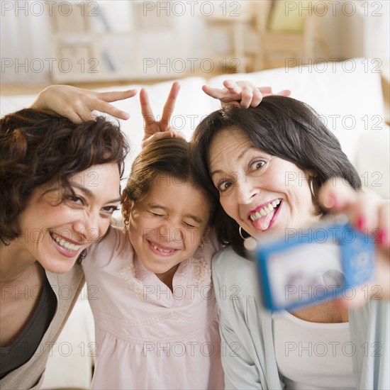 Family taking self-portrait with digital camera