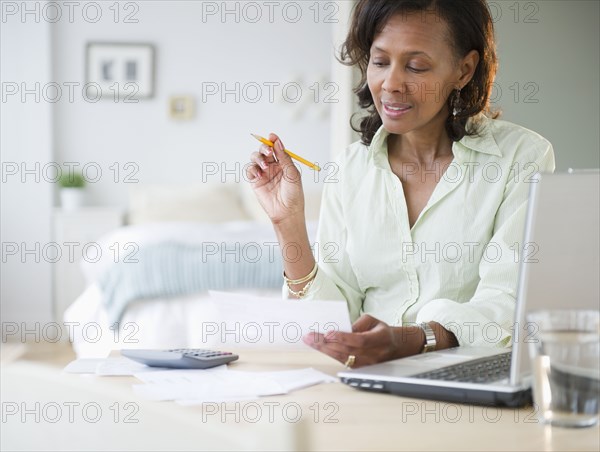 Black woman paying bills