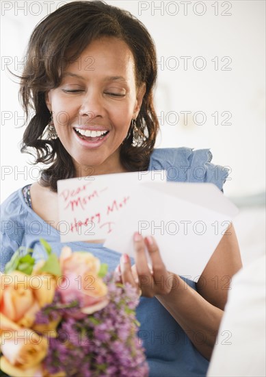 Black woman receiving bouquet of flowers