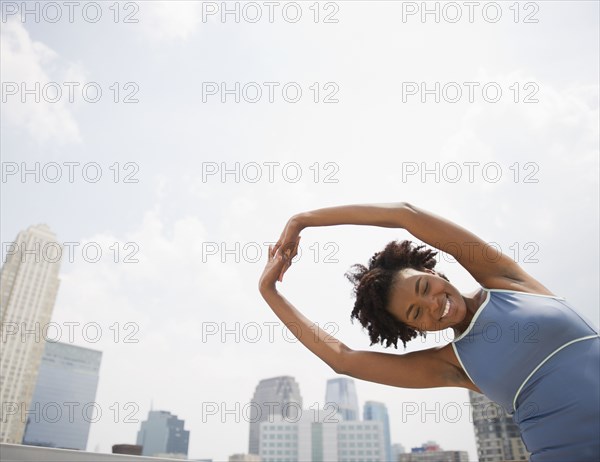 Black woman stretching before exercise