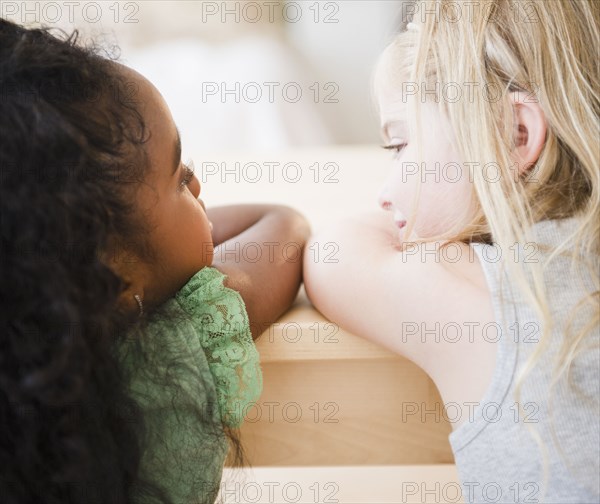 Girls leaning on table together