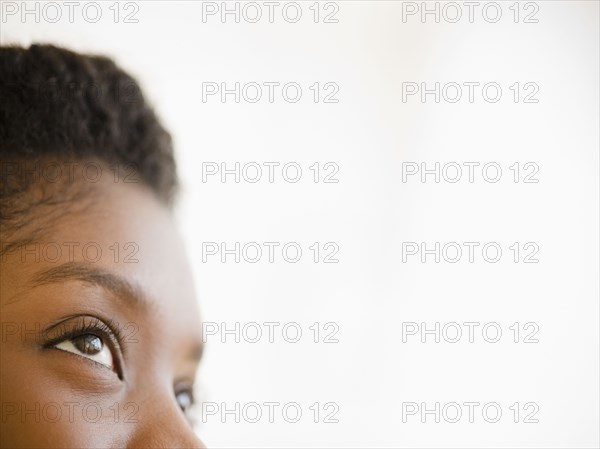 Close up of Black woman looking upwards