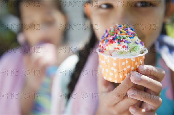 Hispanic girls eating ice cream