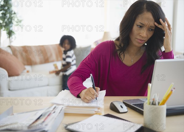 Frustrated African American woman working from home