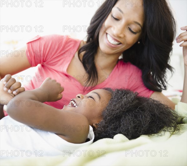 African American mother playing with son