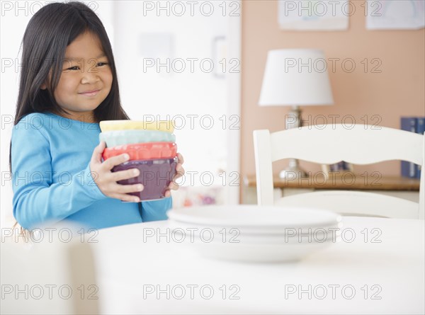 Korean girl setting the table