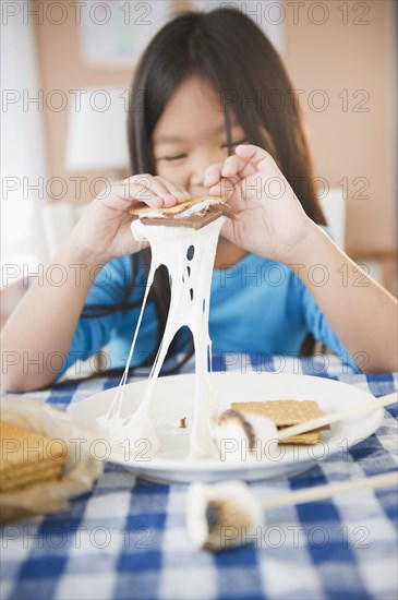 Korean girl eating smores