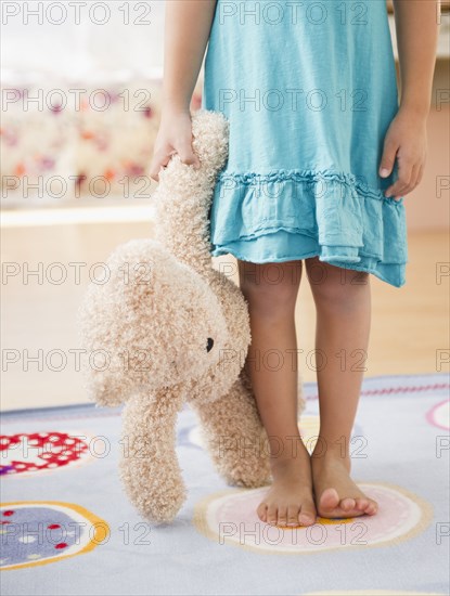 Korean girl holding teddy bear