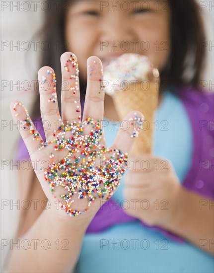 Korean girl with sprinkles on her hand