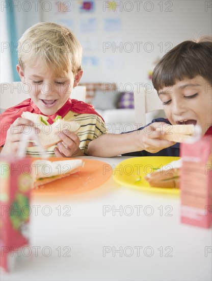 Boys eating lunch together