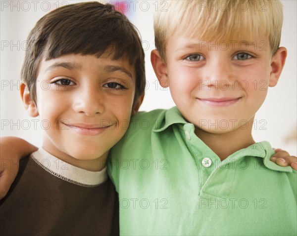 Smiling boys hugging