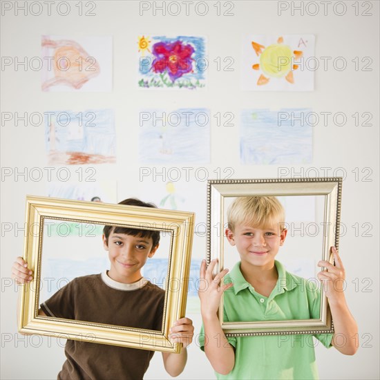 Boys looking through empty frames