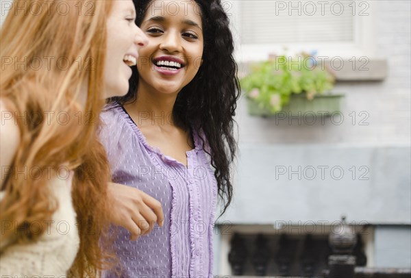 Smiling friends walking outdoors