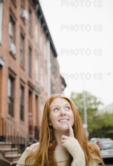 Caucasian woman thinking outdoors