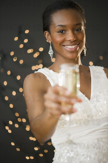 Black woman drinking Champagne - Photo12-Tetra Images-JGI-Jamie Grill