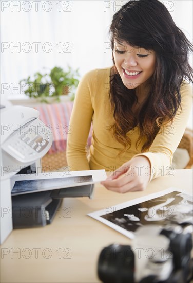 Pacific Islander making photocopies