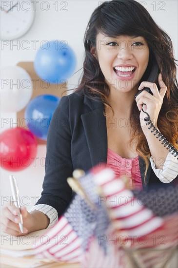 Pacific Islander woman volunteering at political headquarters