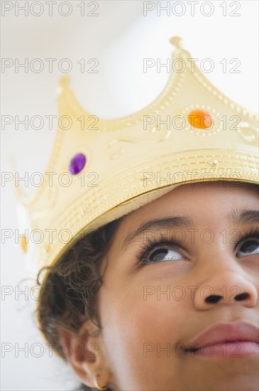 Mixed race girl wearing crown