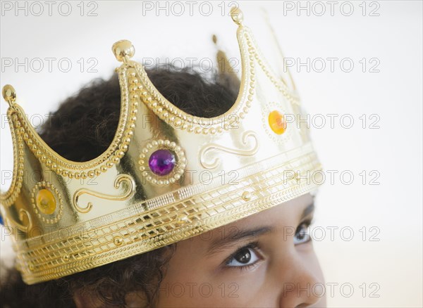 Mixed race girl wearing crown