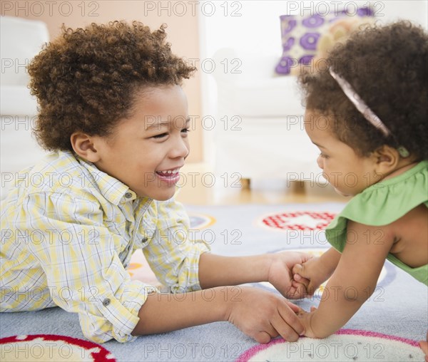 Black brother and sister playing together