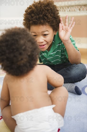 Black brother and sister playing