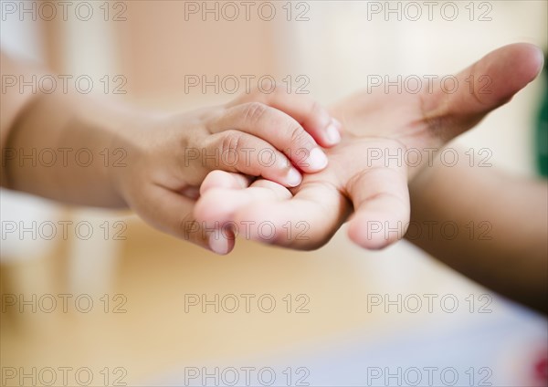 Black brother and sister holding hands