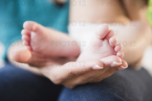 Close up of mixed race baby's feet