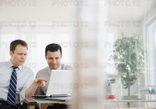 Businessmen working together in office