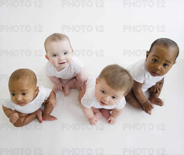 Babies sitting on floor