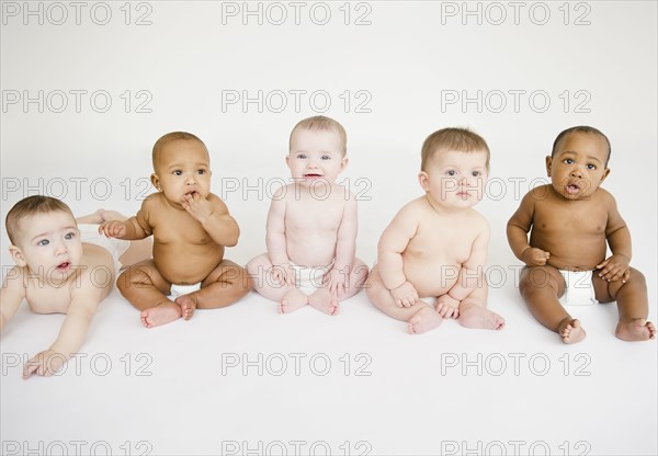 Babies sitting together on floor