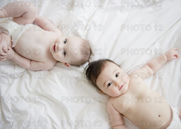 Babies laying on blanket