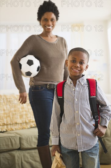 Black mother and son getting ready for the day