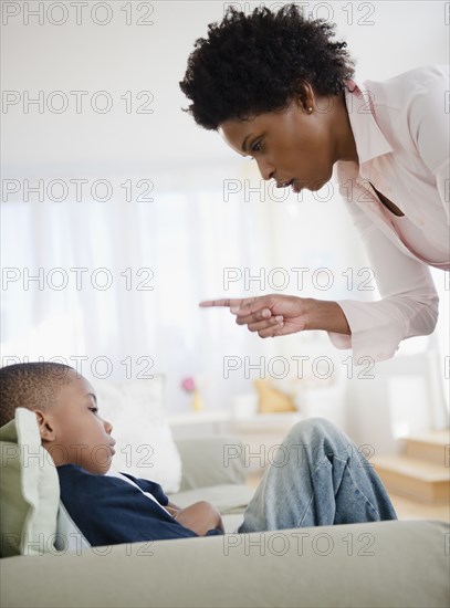 Black mother scolding son