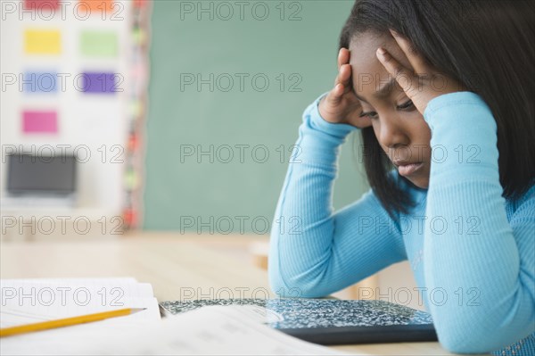 Black student studying in classroom