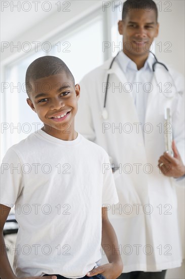 African American boy having checkup with doctor