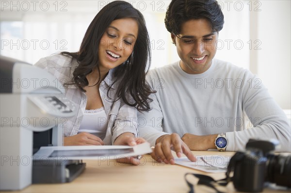 Mixed race couple printing documents