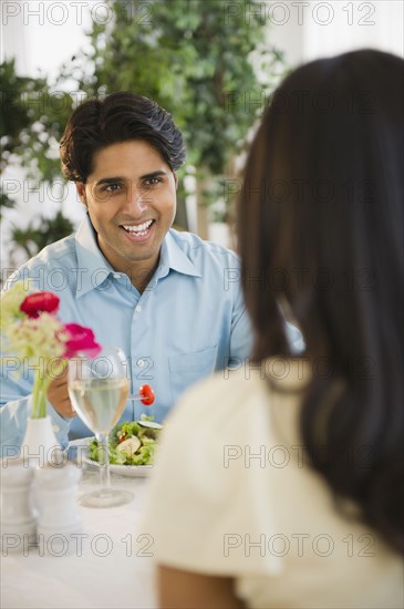 Mixed race couple dining together