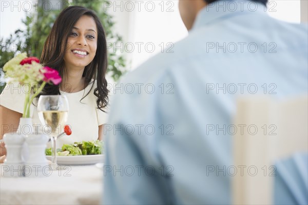 Mixed race couple dining together