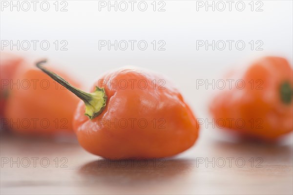 Close up of orange chili peppers