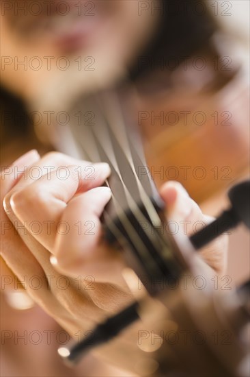 Cape Verdean woman playing the violin