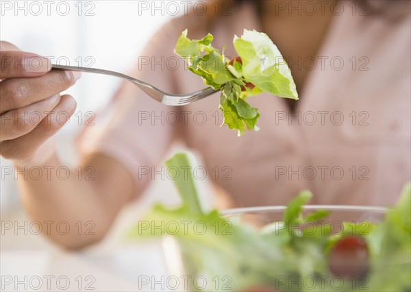 Cape Verdean woman eating salad