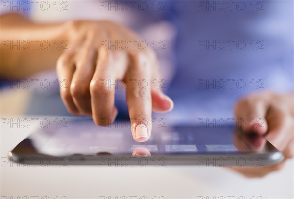 Cape Verdean woman using digital tablet